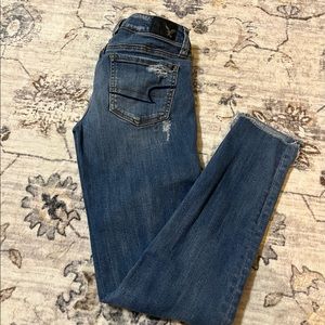 AE Ripped Jegging size 0 Low Waisted Super Stretch light blue denim